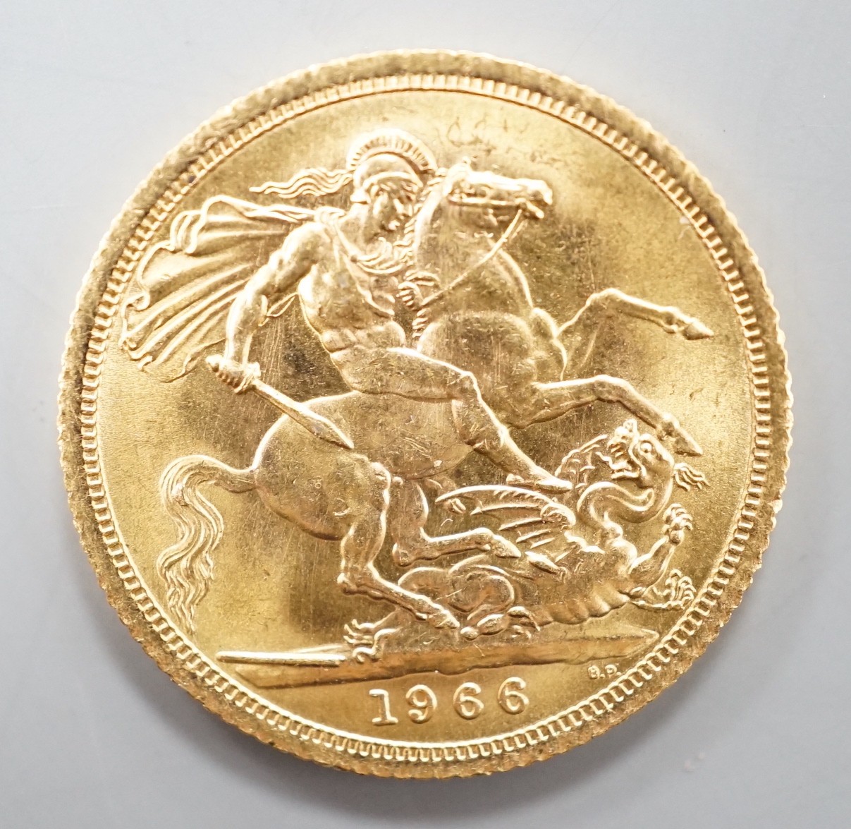 An Elizabeth II 1966 gold sovereign.